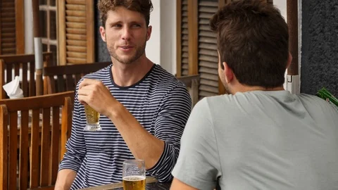 Two guys bonding over beer Video stock 93936746