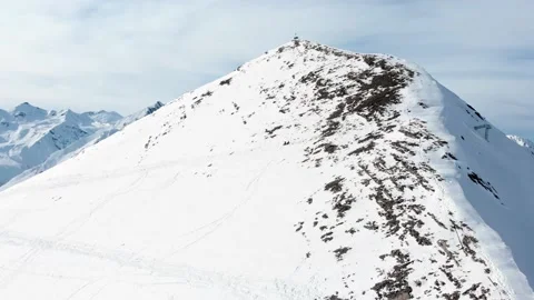 Two guys buddies relax rest sit on snow enjoy mountain panorama after hike .. 動画素材 226842989