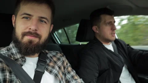 Two guys in a car. They shoot stories for social networks. Gay couple at home Video stock 220227003