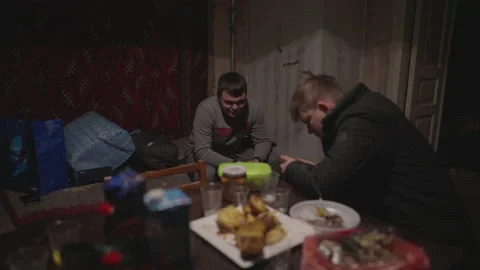 Two guys chat in a room with a dull interior Stock Footage 231708136