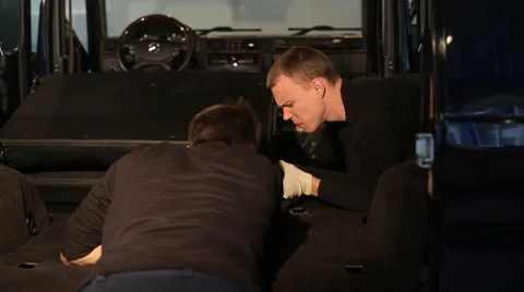 Two guys dismantled machine Stock Footage 56024047