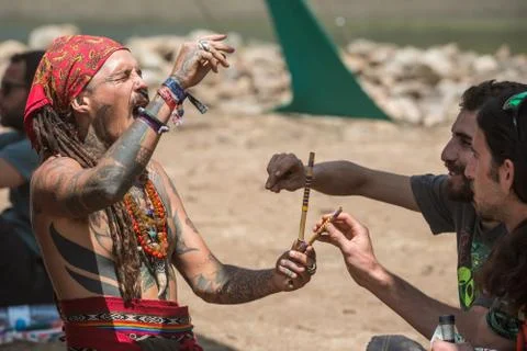 Two guys during a rape ceremony at the Lost Theory psytrance music festival Stock Photos