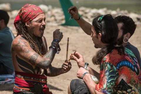 Two guys during a rape ceremony at the Lost Theory psytrance music festival Stock Photos