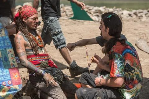 Two guys during a rape ceremony at the Lost Theory psytrance music festival Stock Photos