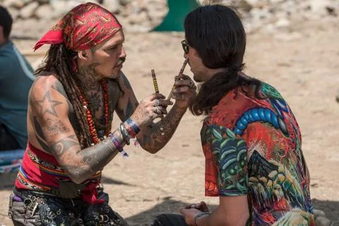 Two guys during a rape ceremony at the Lost Theory psytrance music festival Stock Photos