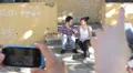 two guys goofing around doing funny poses - cell phones - photo - make faces HD Footage