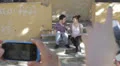 two guys goofing around doing funny poses - cell phones - photo HD Footage