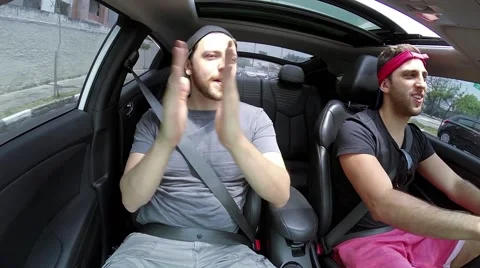 Two Guys Having Fun and Dancing in the Car Stock Footage 43076110