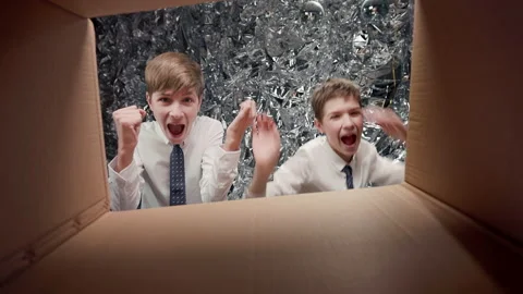 Two Guys Open Box. They Rejoice. Look From Middle Of Box. Stock Footage 182021672