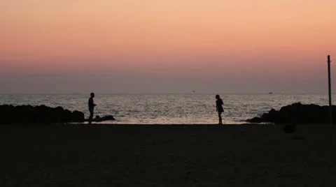 two guys playing beach-tennis at the sun... | Stock Video | Pond5