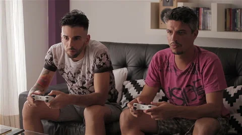 Two guys playing game Stock Footage 50863295