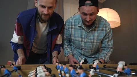 Two Guys Playing Table Soccer Stock Footage 150290710