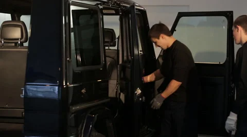 Two guys pulled out of the car seat Stock Footage 56023952