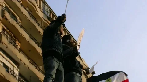 Two guys in tahrir square with flag 動画素材 10969812