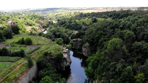 Two guys take a selfie from a drone on a rock near a canyon Stock Footage 200934694
