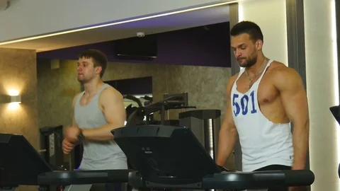 Two Guys on a Treadmill Stock Footage 75344289