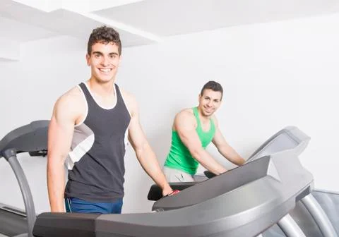 Two guys on treadmill Stock Photos