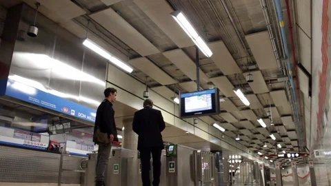 Two Guys Try To Trick The TTC Subway Station's System and Fail Stock Footage 76399346