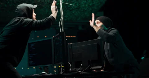 Two hackers break into the banking system and steal customer data. The guys are 库存影片 146091835