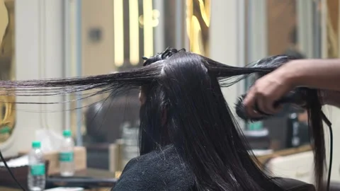 Two Hair Dryers Used Simultaneously for Fast Professional Hair Styling Stock Footage 325528963