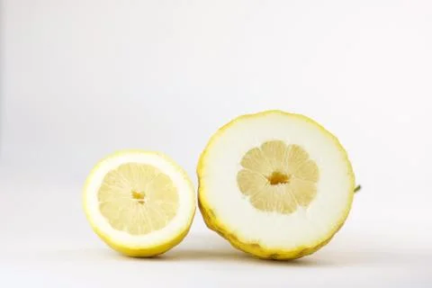Two half of different lemons Stock Photos