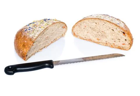 Two half loafs of bread with knife Stock Photos