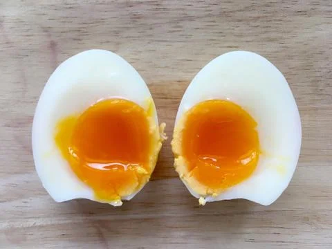Two half of medium boiled eggs, top view Foto stock