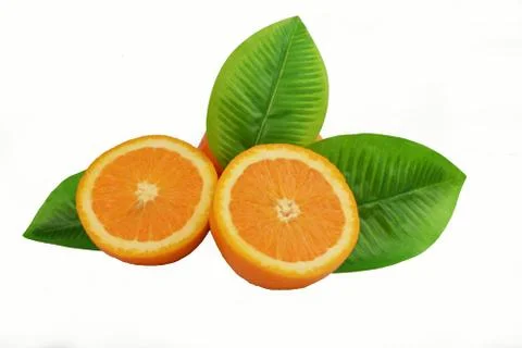 Two half ripe orange fruit Stock Photos