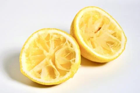 Two half spent lemons Stock Photos