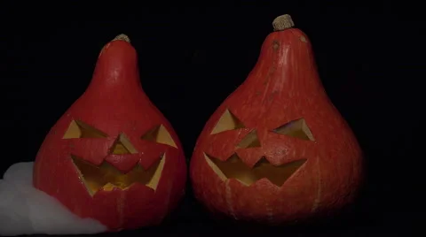 Two halloween pumpkins with ground rolling smoke Video stock 54896892