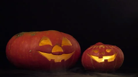 Two halloween pumpkins spew smoke Stock-Footage 54893607