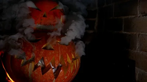 Two Halloween pumpkins on top of each other. Smoke is pouring out of the eye.  Stock Footage 116893330
