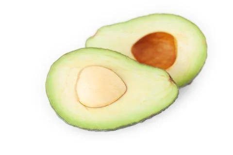 Two halves of avocado isolated on white Stock Photos
