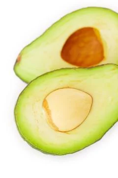 Two halves of avocado isolated on white Stock Photos