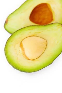 Two halves of avocado isolated on white Stock Photos