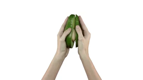 Two halves of avocado on white background Video stock 71628612