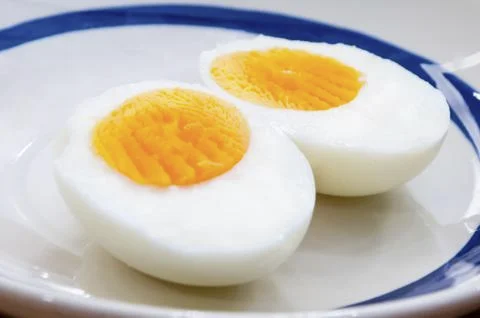 Two halves of a boiled egg Stock Photos