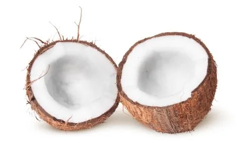 Two halves of coconut lying next 스톡 사진
