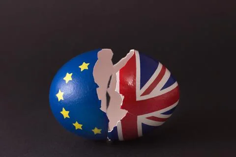 Two halves of cracked eggshell, one of which is decorated with the flag of Eu Stock Photos