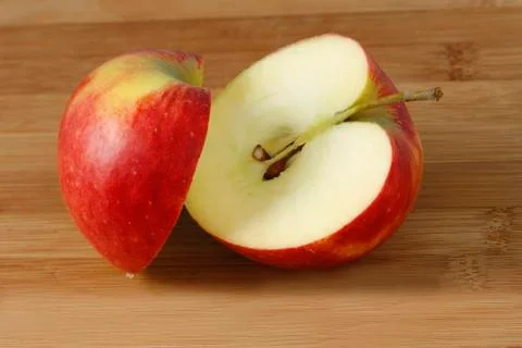 Two halves of an elstar apple (malus) Stock Photos