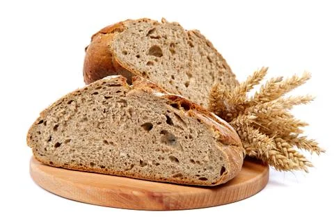 Two halves a loaf of rye bread and wheat ears. Stock Photos