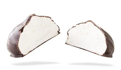 Two halves of marshmallows in chocolate flies on a white. Isolated Stock Photos