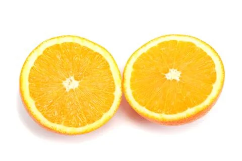 Two halves of orange isolated on white background. Stock Photos