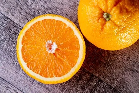 Two halves of an orange top view. Preparation of freshly squeezed juice Stock Photos