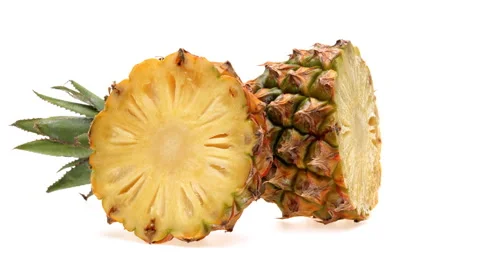 Two halves of pineapple fruit rotating. Isolated on the white background. Vídeo Stock 169748928