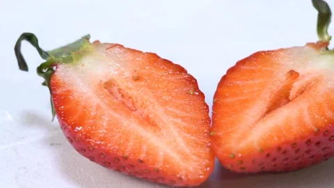 Two halves of red strawberry Stock Footage 156797734