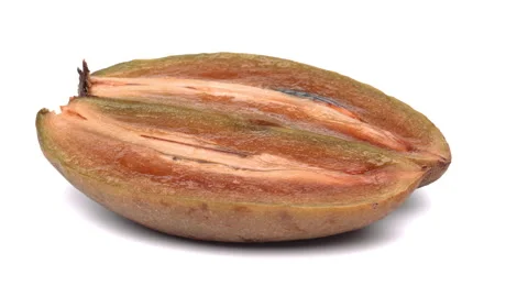 Two halves of sapodilla fruit rotating. Closeup. White background. Stock Footage 158527559