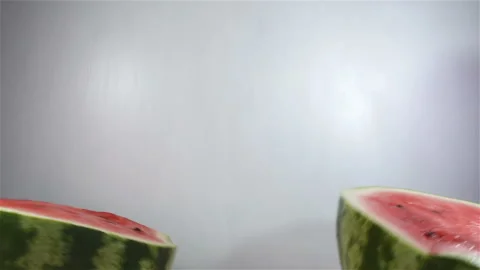 Two halves of a watermelon in slow motion Stock Footage 138685319