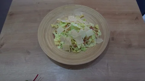 Two hamburger with salad and roasted potatoes on table slow motion Video stock 129140642