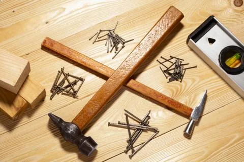 Two hammers and nails. concept of home improvement Stock Photos
